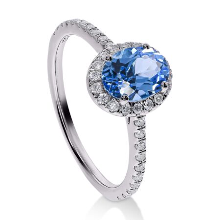 DULCI Halo-Ring aus Gold, Ovaler Swiss Blue Topas 1,10 ct mit Akzent-Diamanten